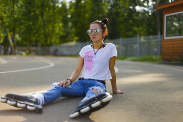 Summer girl in Park rollerblading