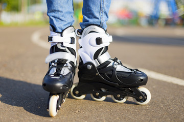 Summer girl in Park rollerblading
