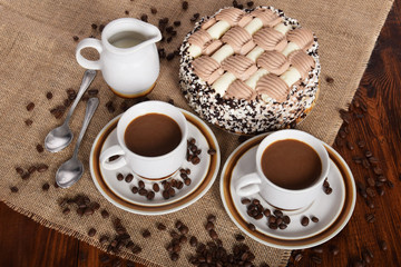 cups of coffee and milk and roasted coffee beans