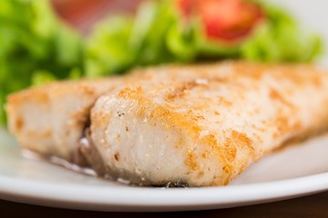 Fried fish with vegetable.