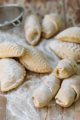 Roll cookies with nuts on a wooden table. Georgian dessert. Croissants, pastry rolls.