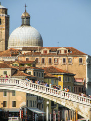 Venice, Italy - Circa July 2015: Ponte degli Scalzi full of tourists and Chiesa di San Simeone...