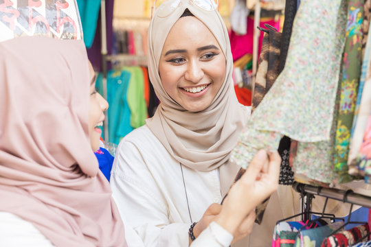 Young muslim women shopping for Hari Raya at a bazaar