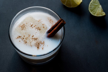 Horchata with Cinnamon stick and lime.