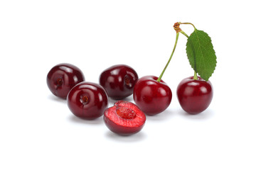 cherry with green leaf isolated on white background