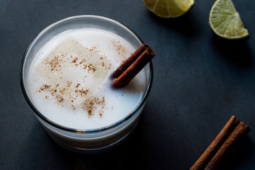 Horchata with Cinnamon stick and lime.