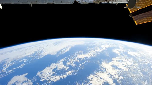 International Space Station (ISS) view of cloudy rotating planet earth. Created from Public Domain images, courtesy of NASA Johnson Space Center