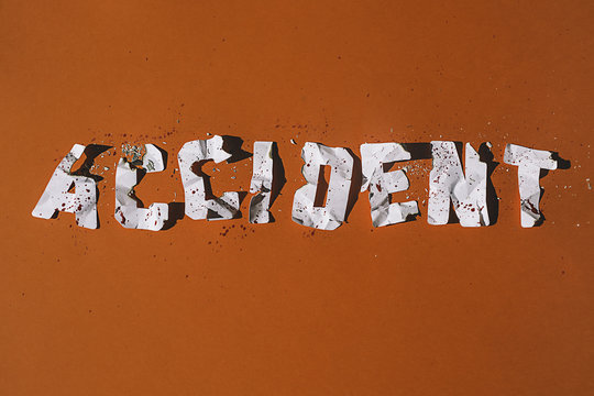 Accident: Crashed paper letters representing an accident