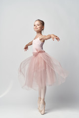 little girl on white isolated background, ballerinas, dancing