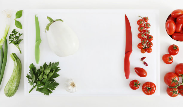 Concept Of Italian Food, Ingredients In Order As The Colors Of The Flag With Cutting Board Isolated On White Worktop, Copy Space, Top View