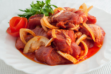 Raw pork beef meat on the white plate