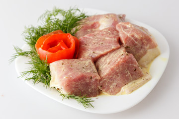 Raw pork beef meat on the white plate