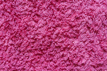Pink color bath cotton towel texture. Background and texture.