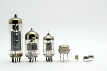 The old glass of the semiconductor lamps stand in a row according to the size, isolated, white background