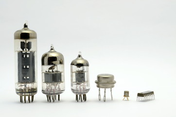 The old glass of the semiconductor lamps stand in a row according to the size, isolated, white...