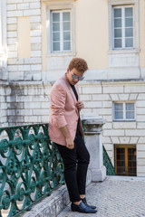 young fashion man on the street of European city