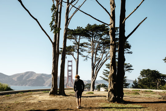 Young man wandering around the coast near the golden gate bridge