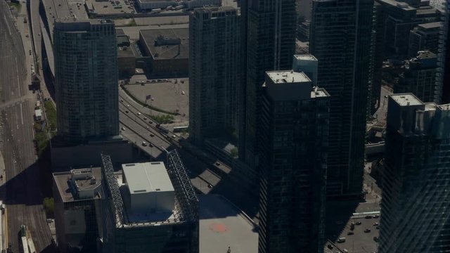 An overhead shot of Toronto's urban density seen from a hight looking downwards at the Gardiner Expressway and the many high rise condominiums surrounding it.