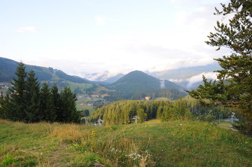 Mountains Tatra landscape with green forest, blue clouds and meadow