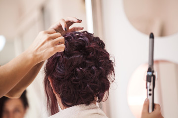 Fototapeta premium Bride at the hair stylist