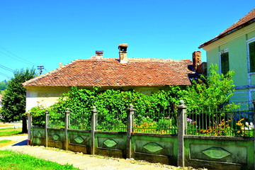 Typical rural landscape and peasant houses in the village Merghindeal- Mergenthal,...