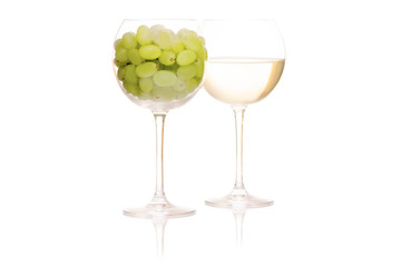 White wine in a glass of grapes