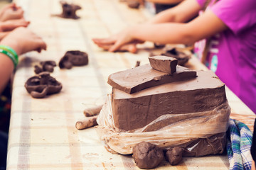 Children molded from clay.