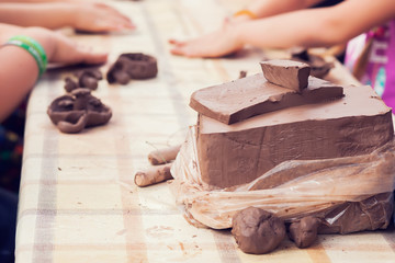 Children molded from clay.