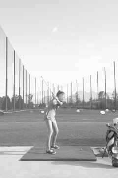 Teen Girl Playing Golf