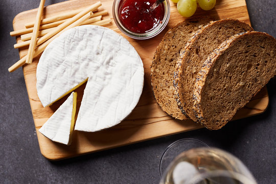 Delicious cheese with bread and grape
