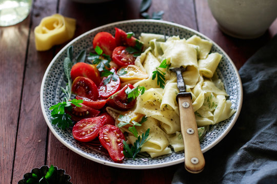 Herb pappardelle with tomatoes and parmesan
