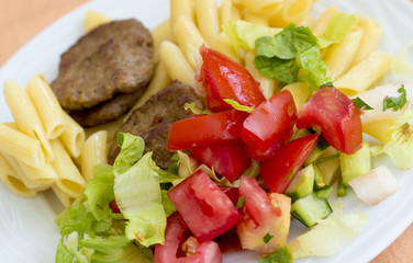 Plate with pasta and meat