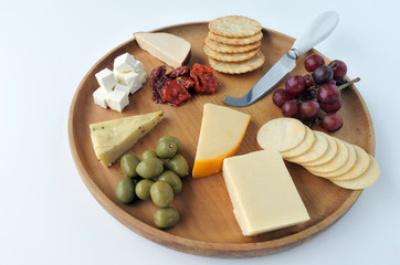 Overhead view of cheese  platter with red wine