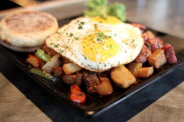 Corned beef hash with eggs sunnyside up.