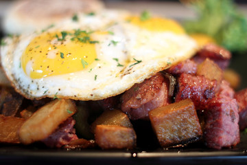 Corned beef hash with eggs sunnyside up.