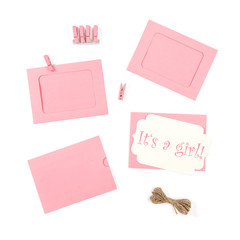 Its a Girl Pink baby shower cards white background flat lay