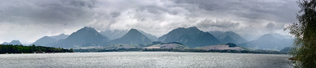 Summertime landscape banner, panorama with view against Liptovska Mara is a reservoir and the mountains Western Carpathians, Zilina Region in the Slovakia