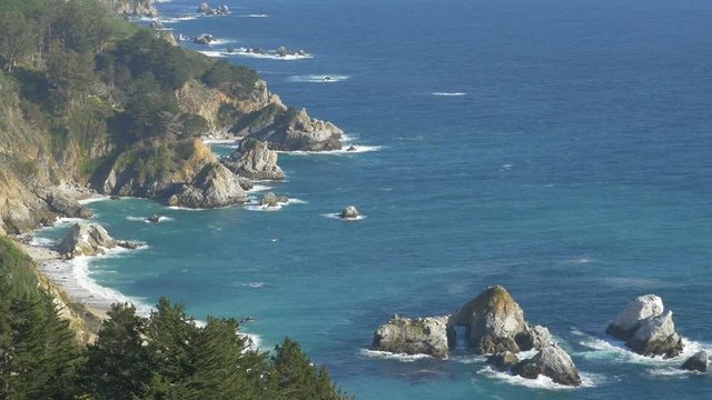 Zooming out view of the rugged Pacific coast in the Big Sur area of Central California.