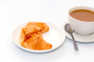 croissant and coffee on white background
