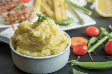 Mashed potatoes in blue bowl.