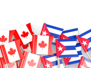 Flag pins of Canada and Cuba isolated on white