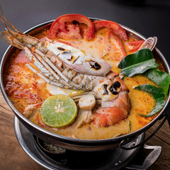 Spicy soup with shrimp in bowl , famous Thai food cuisine calling Tom Yum Kung