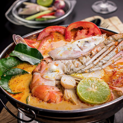 Spicy soup with shrimp in bowl , famous Thai food cuisine calling Tom Yum Kung