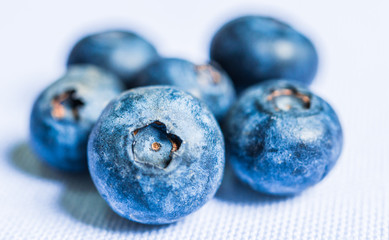 Close up photo of fresh organic blueberries isolated on white