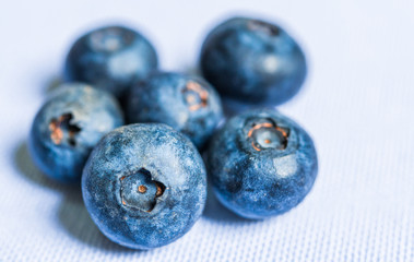 Close up photo of fresh organic blueberries isolated on white