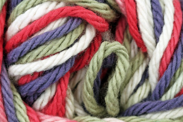 A super close up image of multicolored yarn 