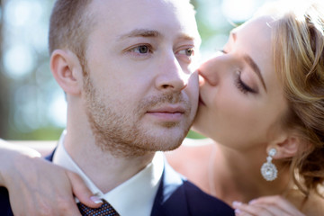 Wedding couple on the nature is hugging each other