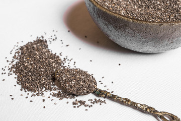 Chia seeds against white background background. Healthy lifestyle and eating concept. Superfood.