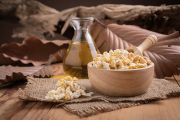 Prepared popcorn in bowl on kitchen table.