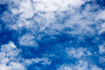white fluffy clouds in the blue sky